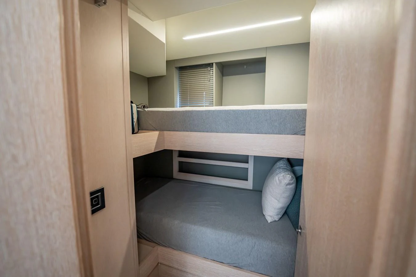 A cozy bunk cabin with modern design and soft lighting. aboard HOTEL COLLECTION Yacht for Sale