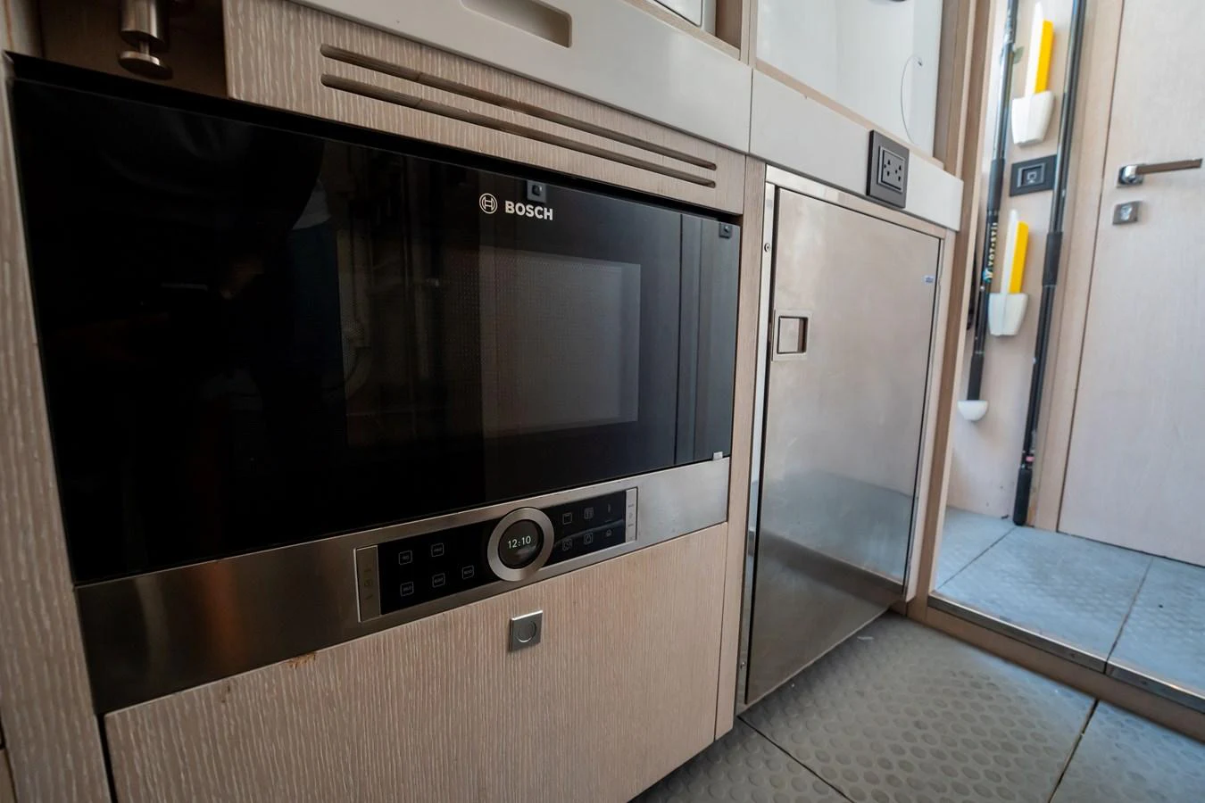 The galley features modern appliances, including a built-in Bosch microwave. aboard HOTEL COLLECTION Yacht for Sale