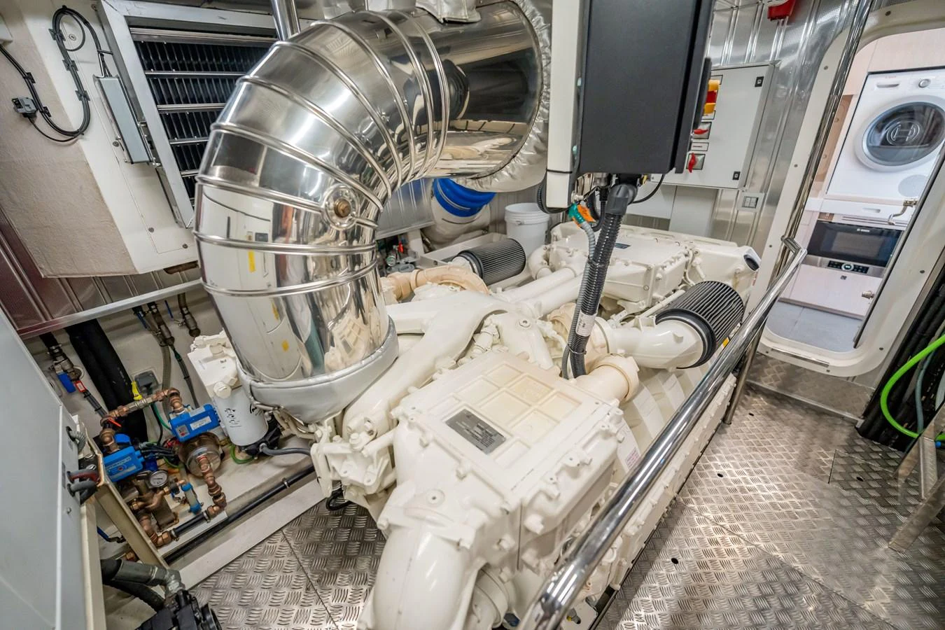 The image showcases the yacht's pristine engine room with well-maintained machinery. aboard HOTEL COLLECTION Yacht for Sale