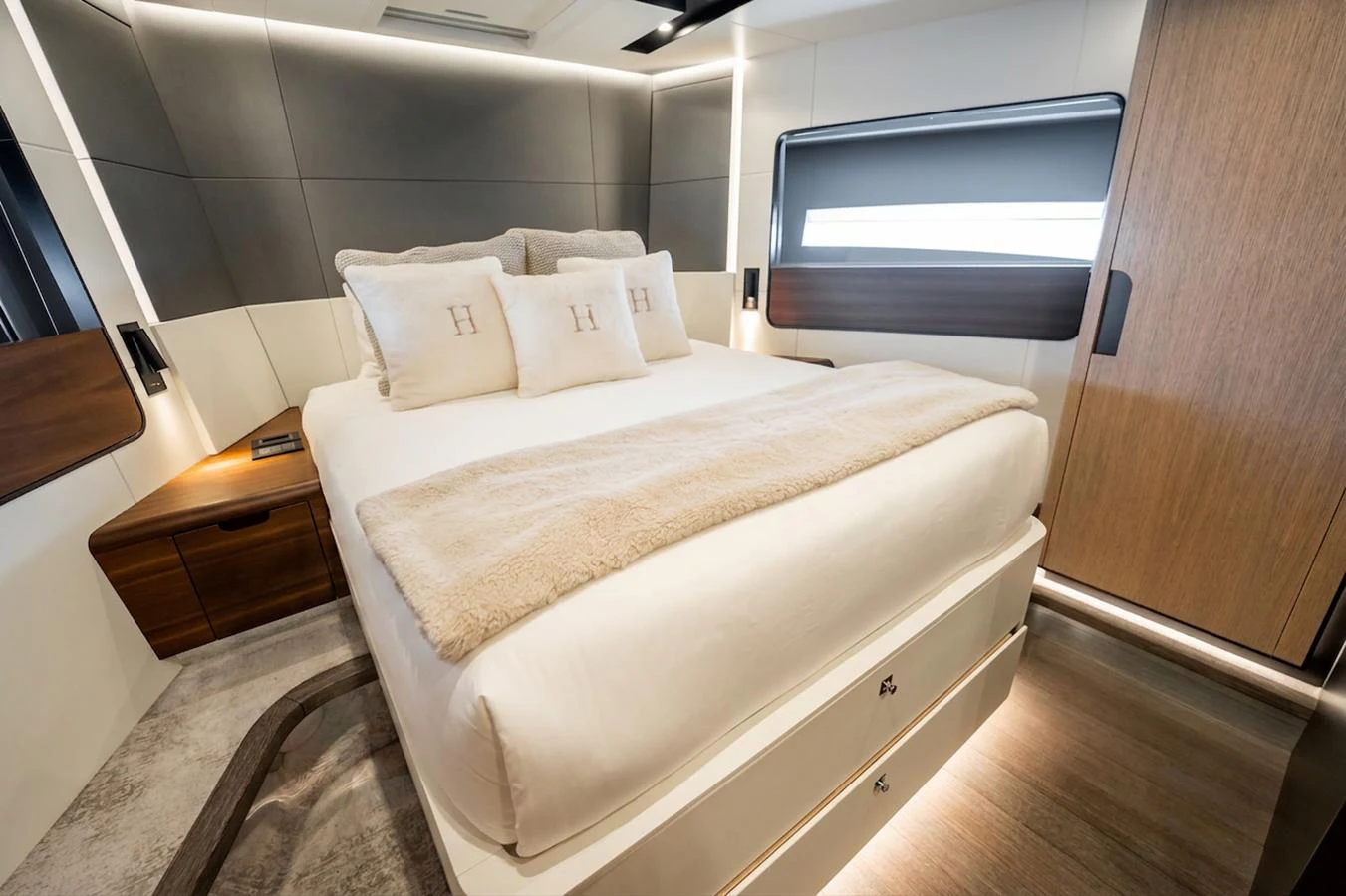 This image showcases a luxurious stateroom with a plush bed and elegant furnishings. aboard HOTEL COLLECTION Yacht for Sale