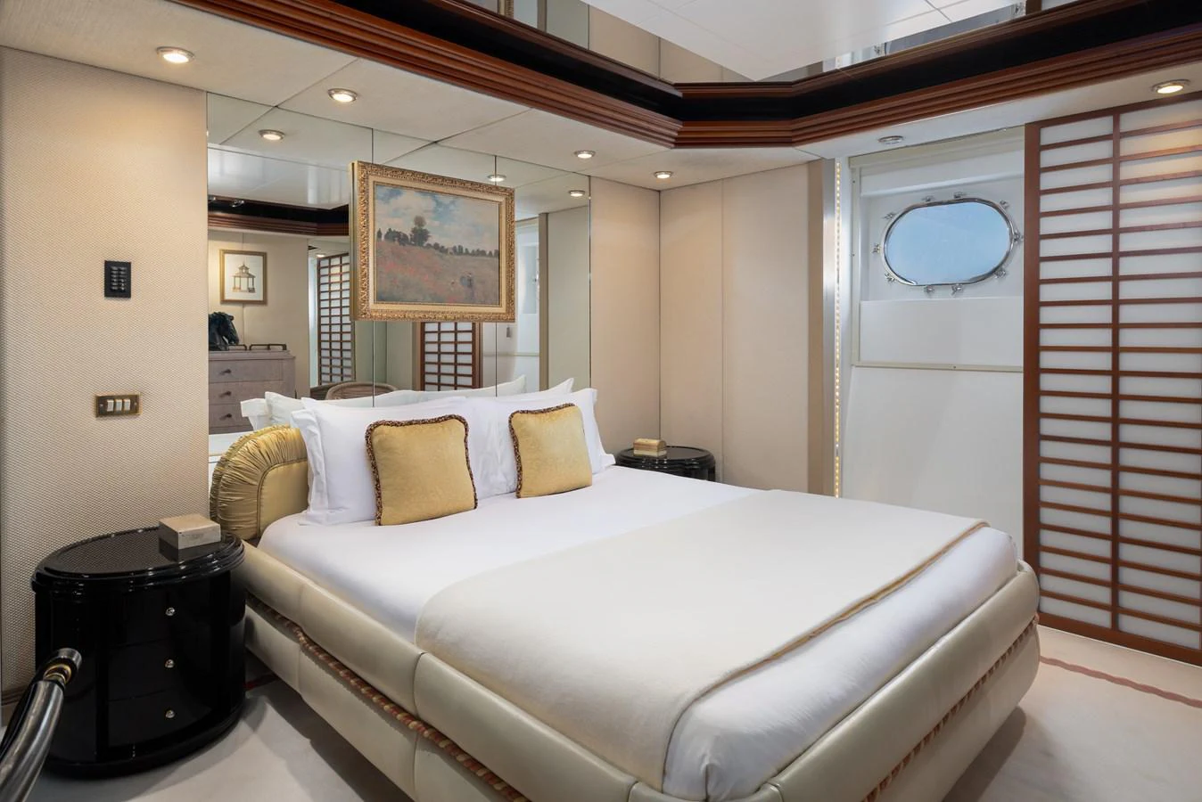 The stateroom features a luxurious bed with elegant decor and ample natural light. aboard MY LADY Yacht for Sale