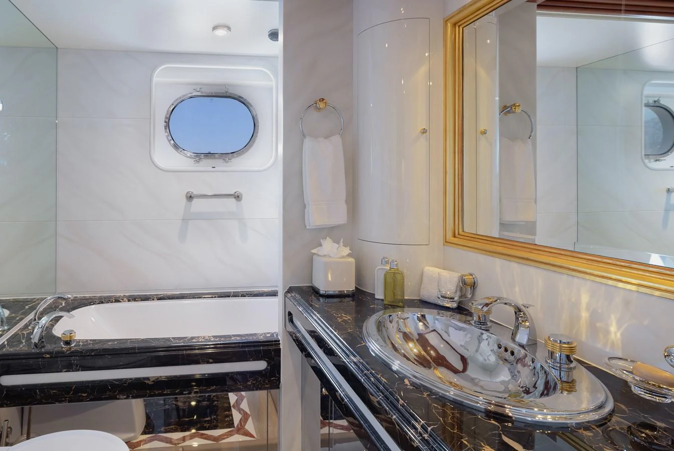 The yacht's bathroom features elegant fixtures and a luxurious design. aboard MY LADY Yacht for Sale