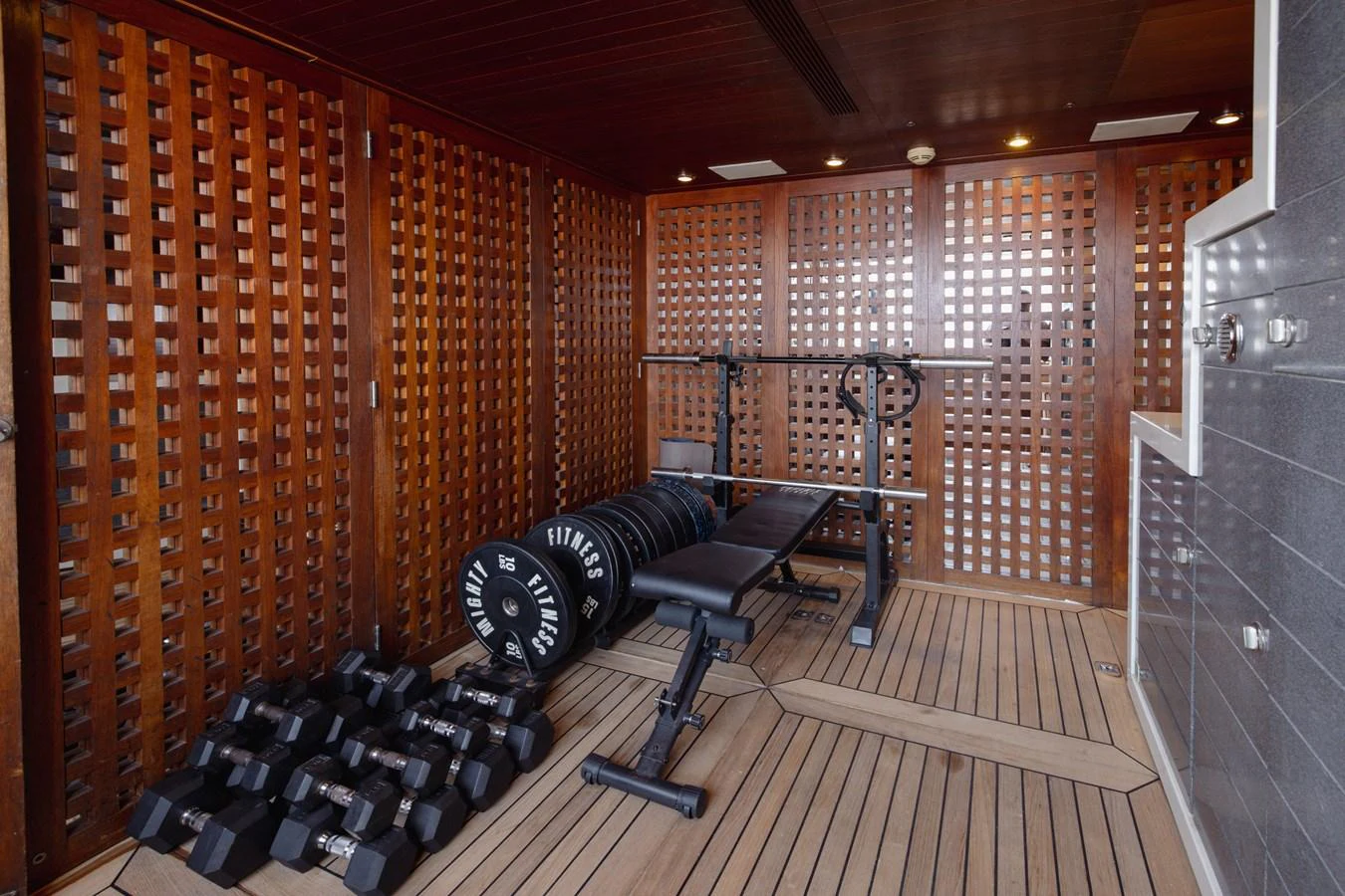 The yacht features a well-equipped gym with modern fitness equipment. aboard MY LADY Yacht for Sale