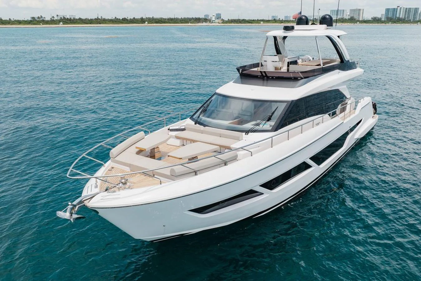 A sleek and modern yacht cruising on calm blue waters with a spacious deck and luxurious design. aboard 2025 FERRETTI 670 KATRIN I Yacht for Sale