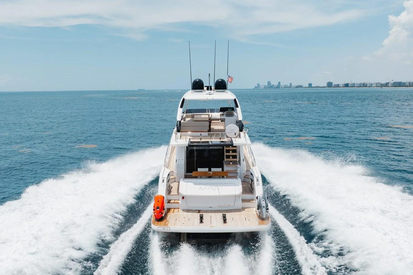 The yacht cruises smoothly on open waters, showcasing its elegant aft deck and modern design. aboard 2025 FERRETTI 670 KATRIN I Yacht for Sale
