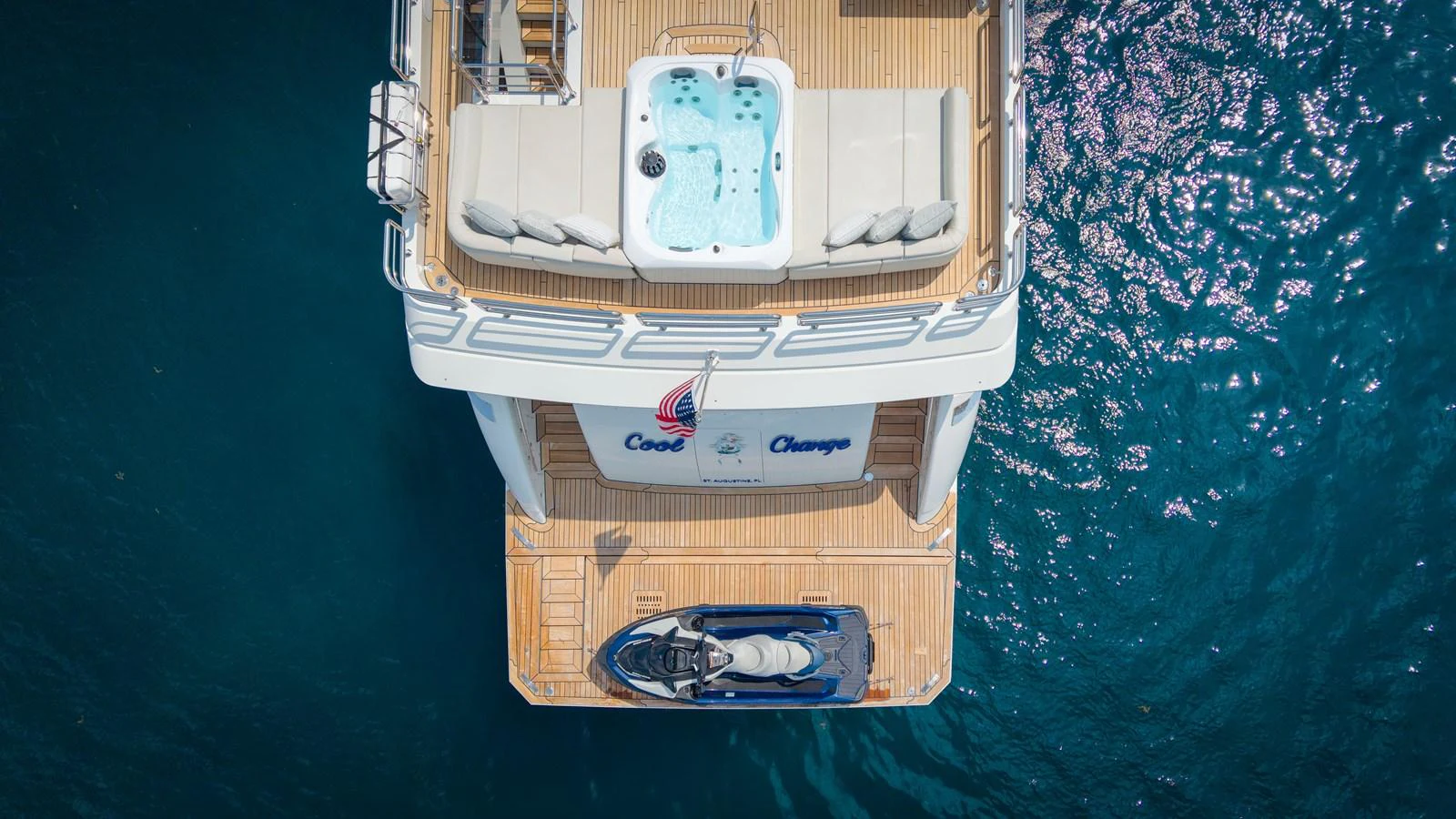 The aft deck features a luxurious hot tub and a personal watercraft for ultimate relaxation and adventure. aboard COOL CHANGE Yacht for Sale