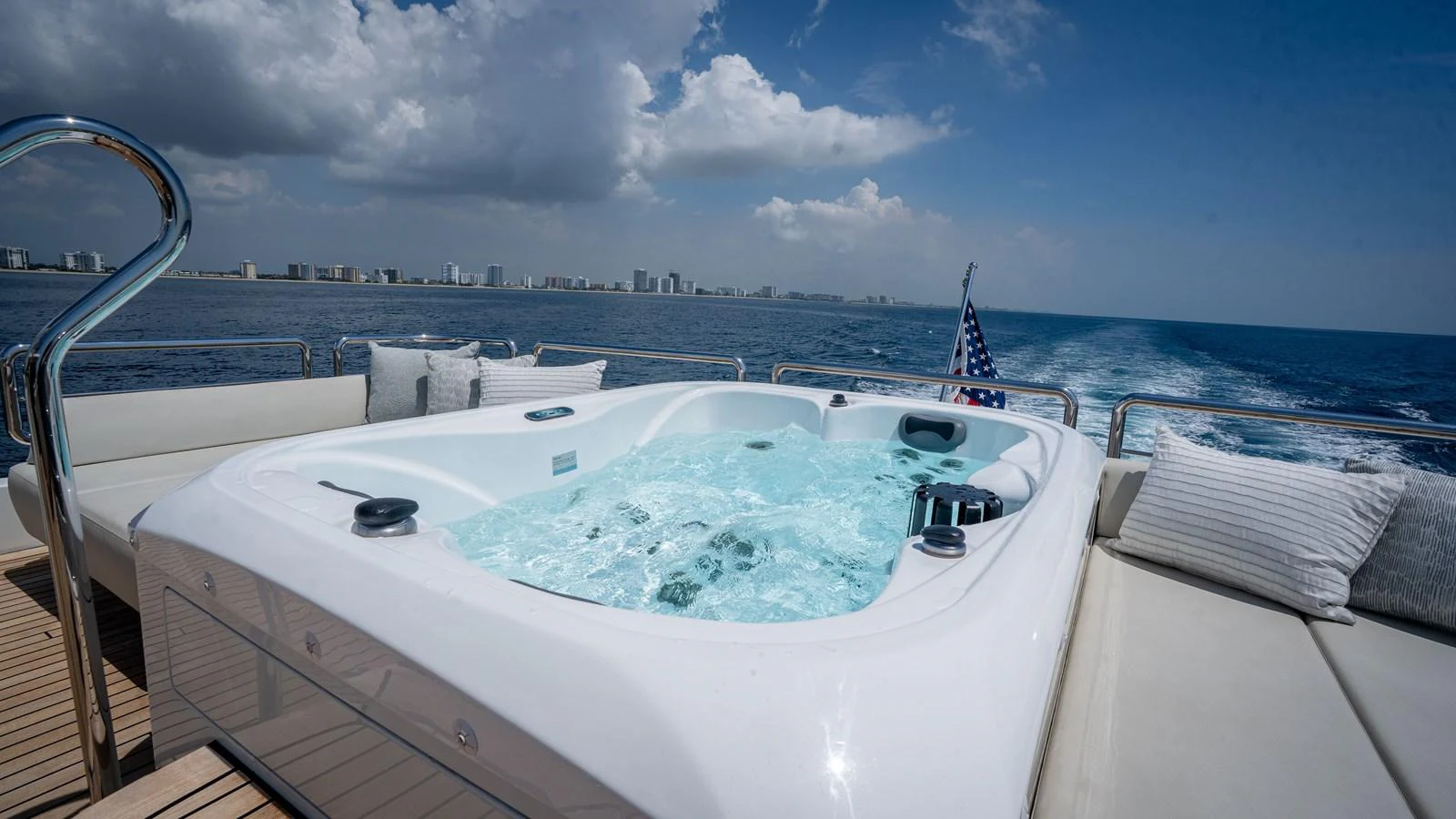 The yacht features a luxurious jacuzzi on the deck with stunning ocean views. aboard COOL CHANGE Yacht for Sale