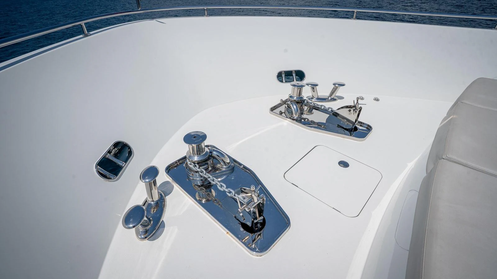 A close-up view of the yacht's deck equipment, showcasing polished metal fittings and a clean, white surface. aboard COOL CHANGE Yacht for Sale