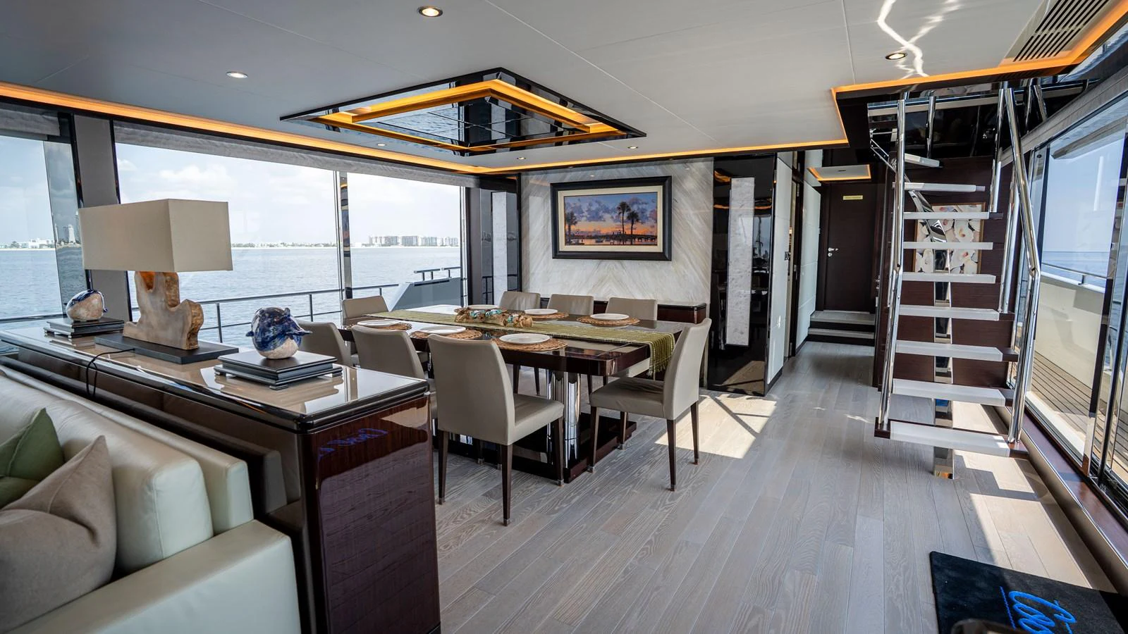 The salon features elegant dining and lounging areas with panoramic views. aboard COOL CHANGE Yacht for Sale