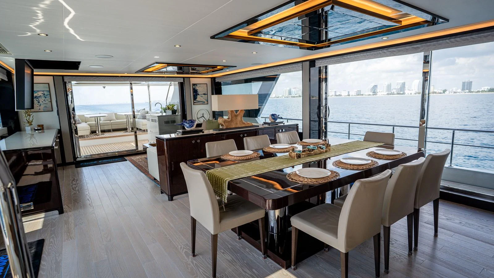The yacht's dining area offers a luxurious setting with panoramic ocean views and elegant table settings. aboard COOL CHANGE Yacht for Sale