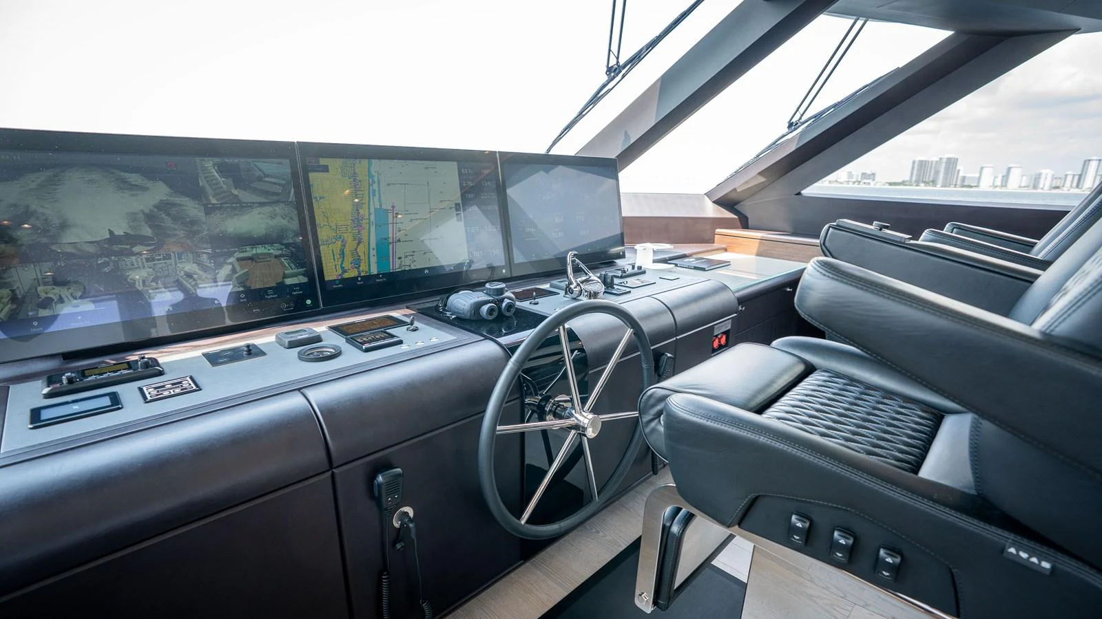The helm station features advanced navigation equipment and luxurious seating. aboard COOL CHANGE Yacht for Sale