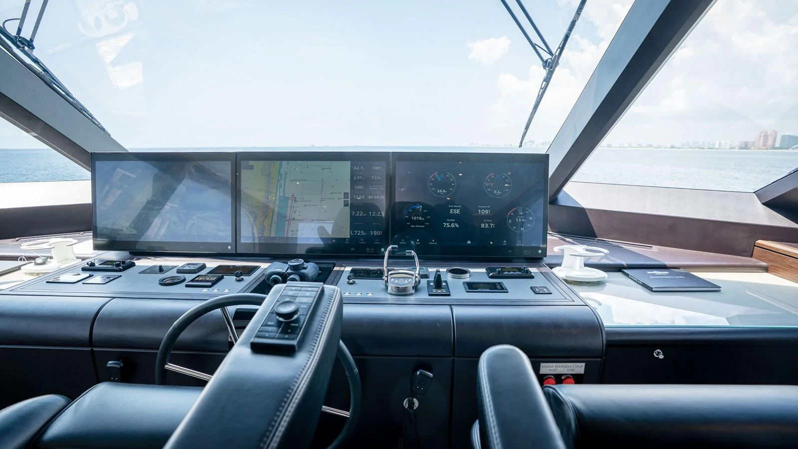 The helm station offers a state-of-the-art navigation experience with panoramic views. aboard COOL CHANGE Yacht for Sale