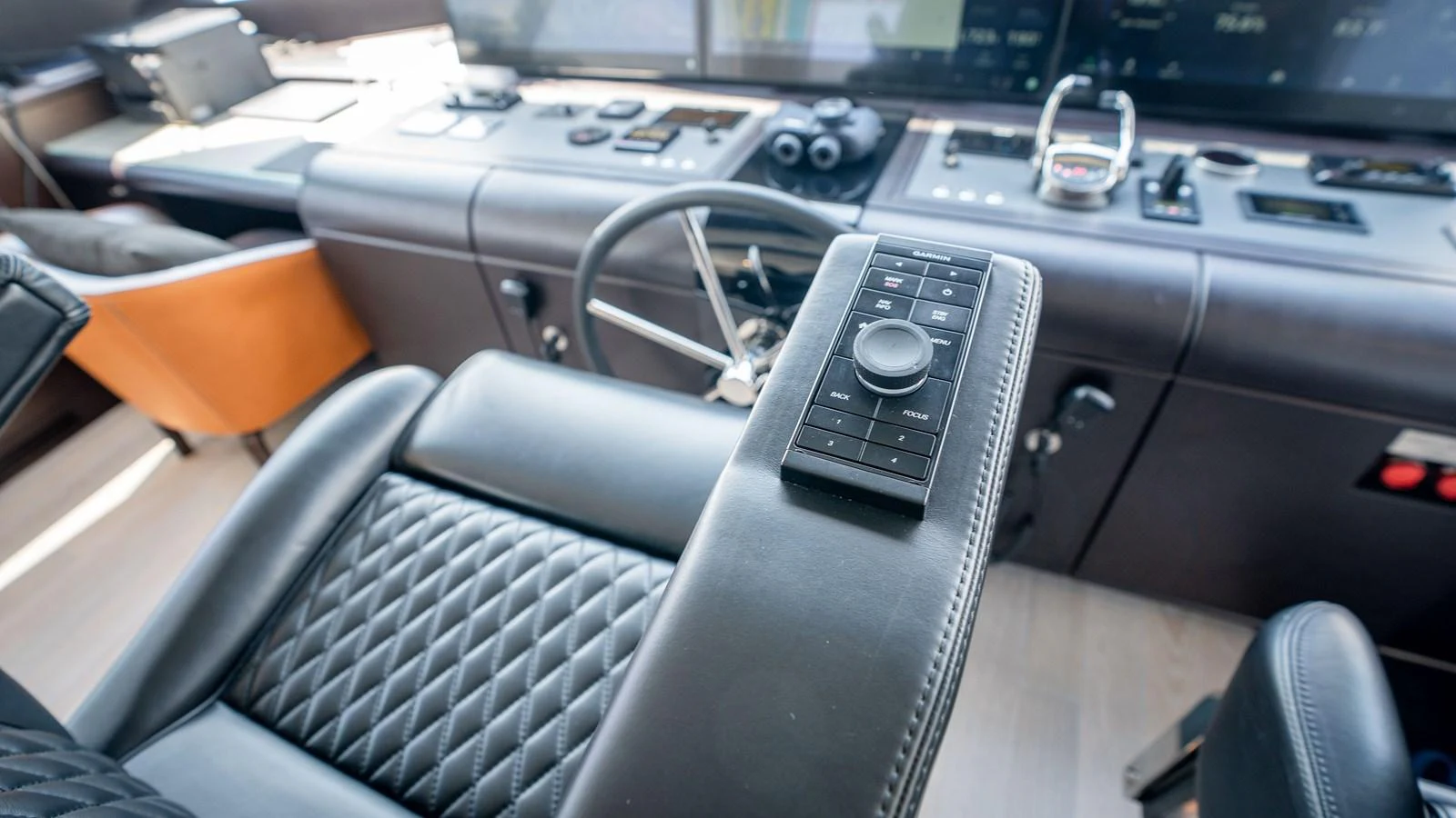 The helm station features advanced navigation controls and luxurious seating. aboard COOL CHANGE Yacht for Sale