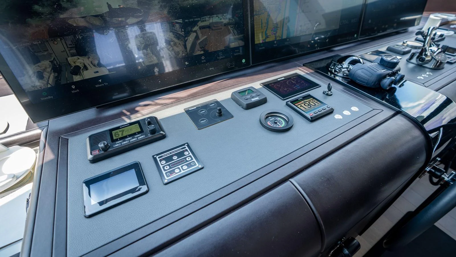 The helm station features advanced navigation and control equipment for precise yacht handling. aboard COOL CHANGE Yacht for Sale