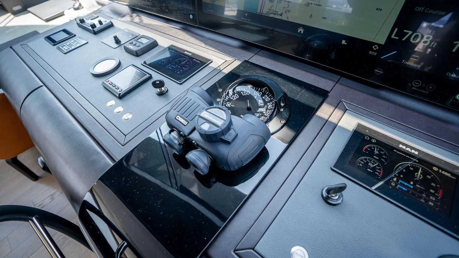 The helm station features advanced navigation instruments and controls for precise yacht operation. aboard COOL CHANGE Yacht for Sale