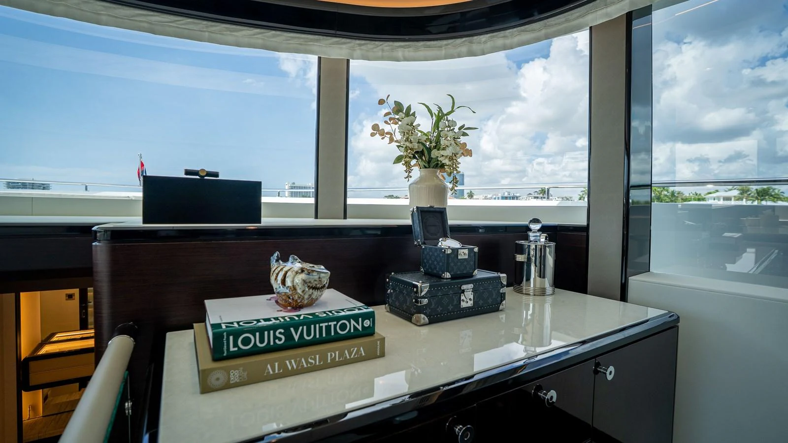A luxurious interior space featuring elegant decor and a scenic view through large windows. aboard COOL CHANGE Yacht for Sale