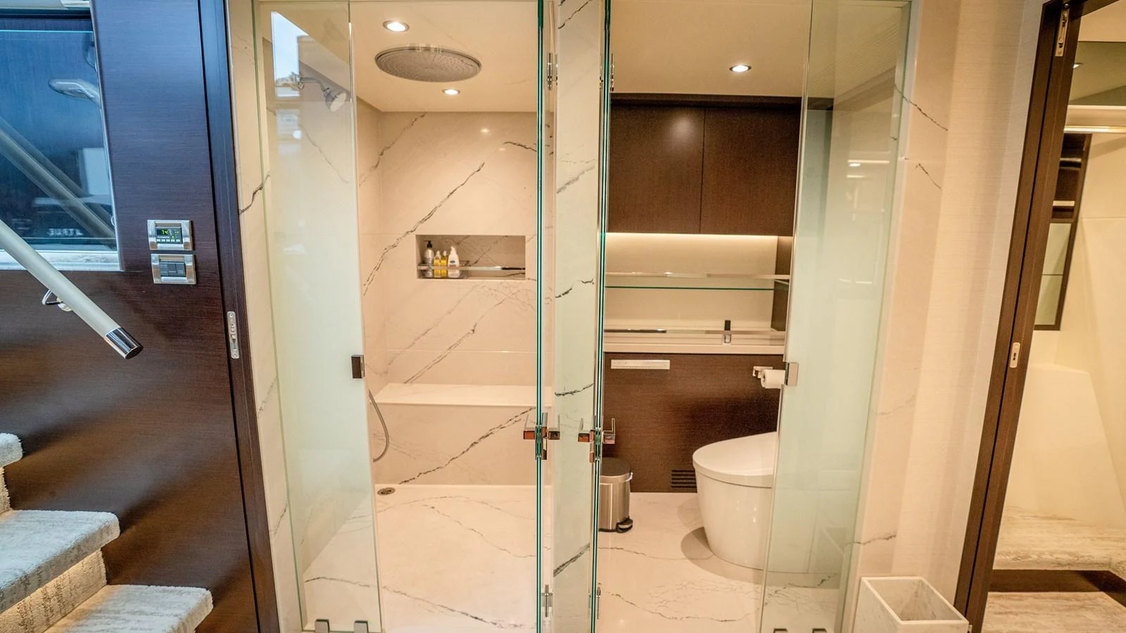 The yacht's bathroom features modern fixtures and elegant marble finishes. aboard COOL CHANGE Yacht for Sale