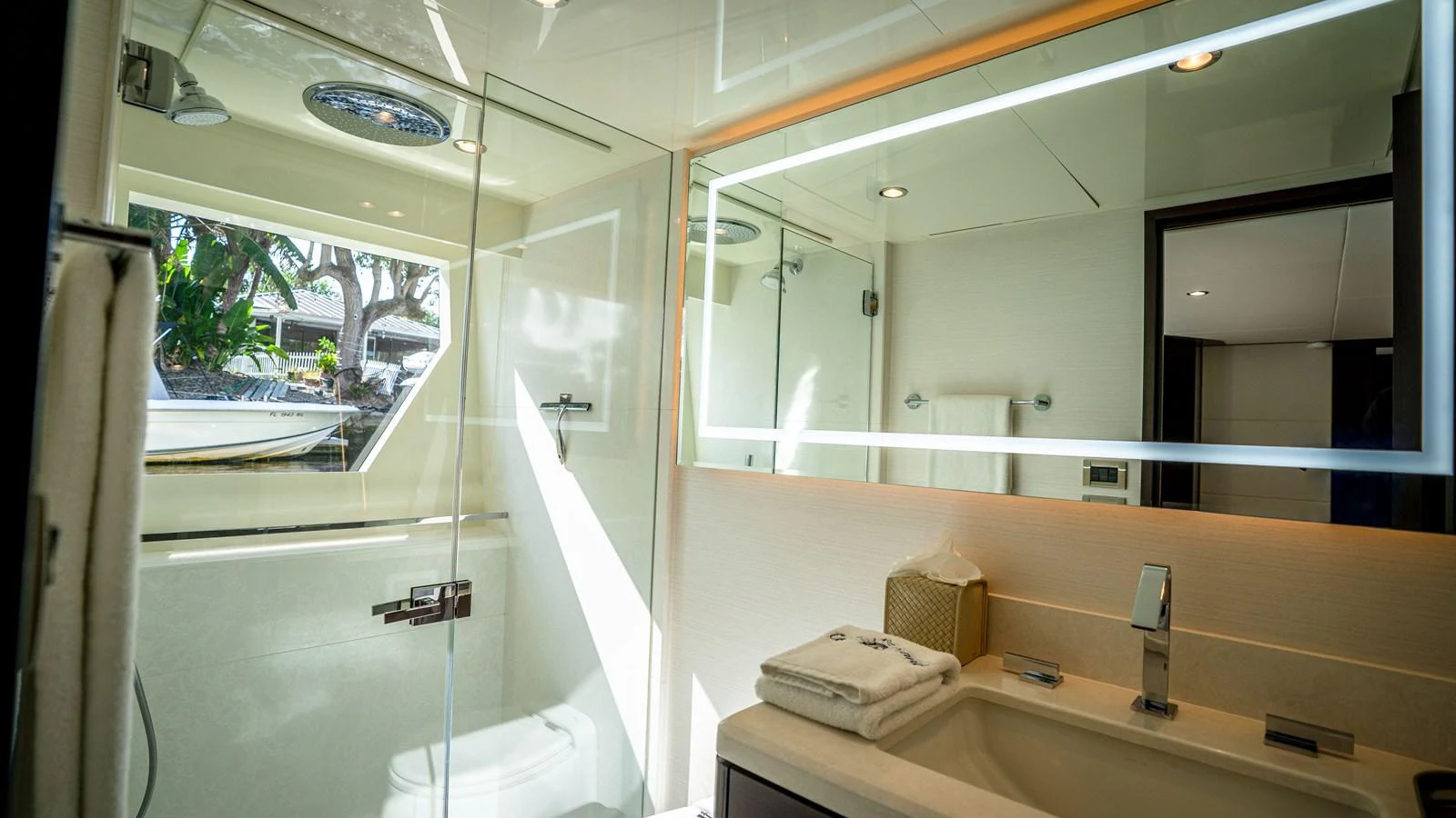 The yacht's bathroom features modern fixtures and a spacious shower area with natural light. aboard COOL CHANGE Yacht for Sale