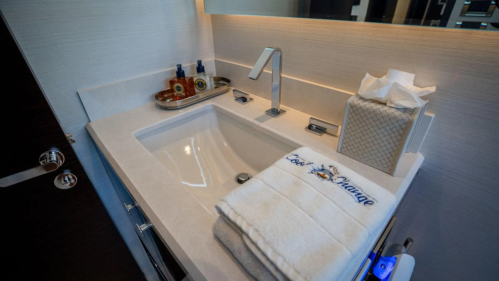 A luxurious bathroom sink area with elegant fixtures and amenities. aboard COOL CHANGE Yacht for Sale