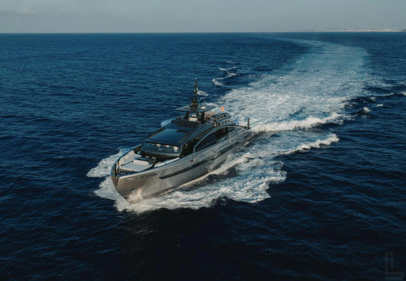A sleek and modern yacht cruises through the open sea, leaving a trail of white wake behind. aboard BYEEE... Yacht for Sale