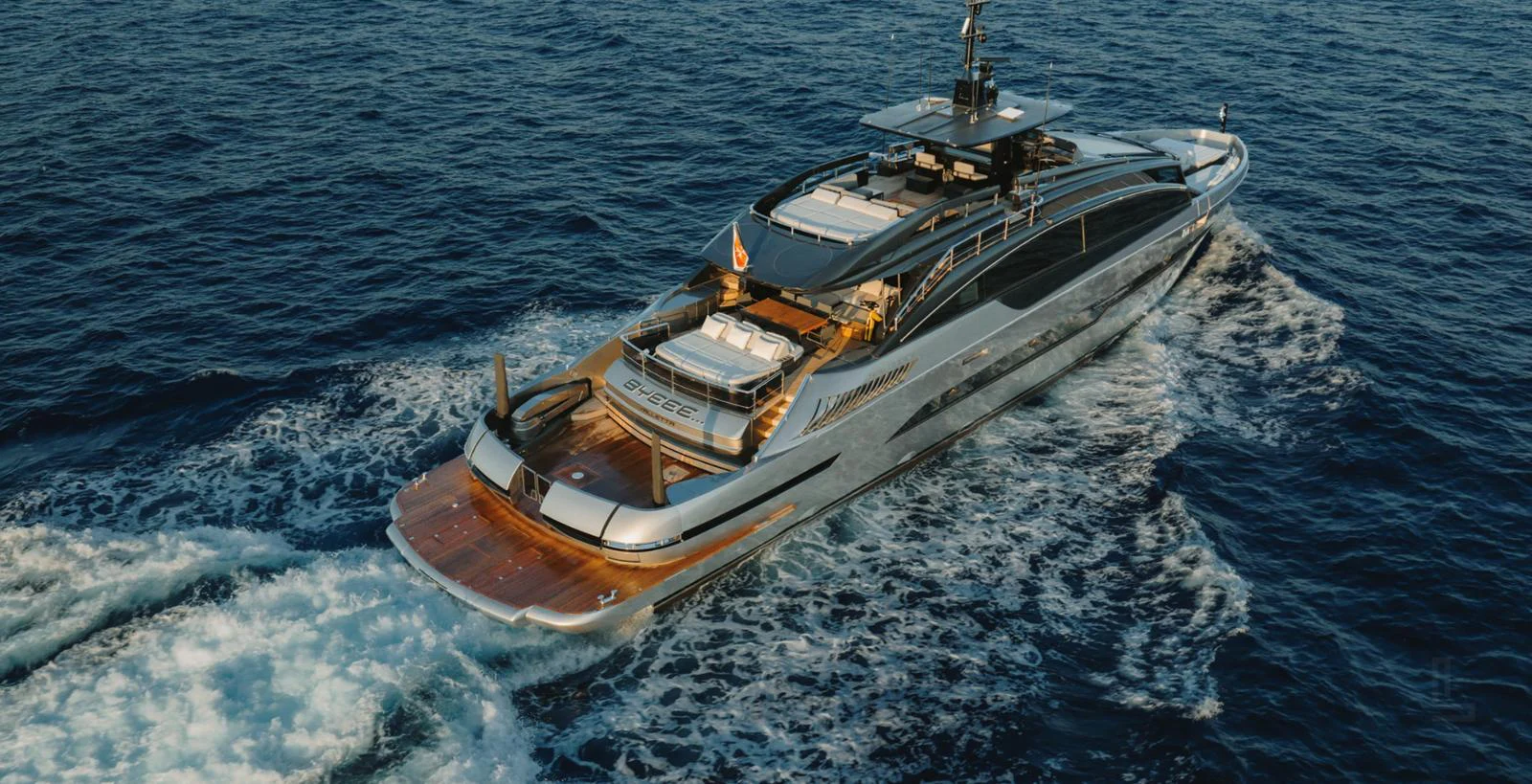 A sleek and modern yacht cruises through the open sea, showcasing its luxurious design and spacious deck areas. aboard BYEEE... Yacht for Sale