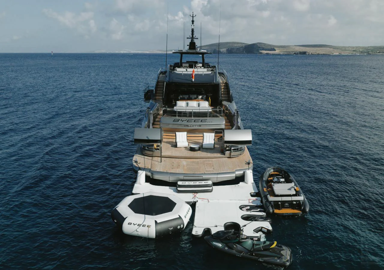 The yacht's aft deck is equipped with various water toys and a spacious lounging area, perfect for enjoying the sea. aboard BYEEE... Yacht for Sale