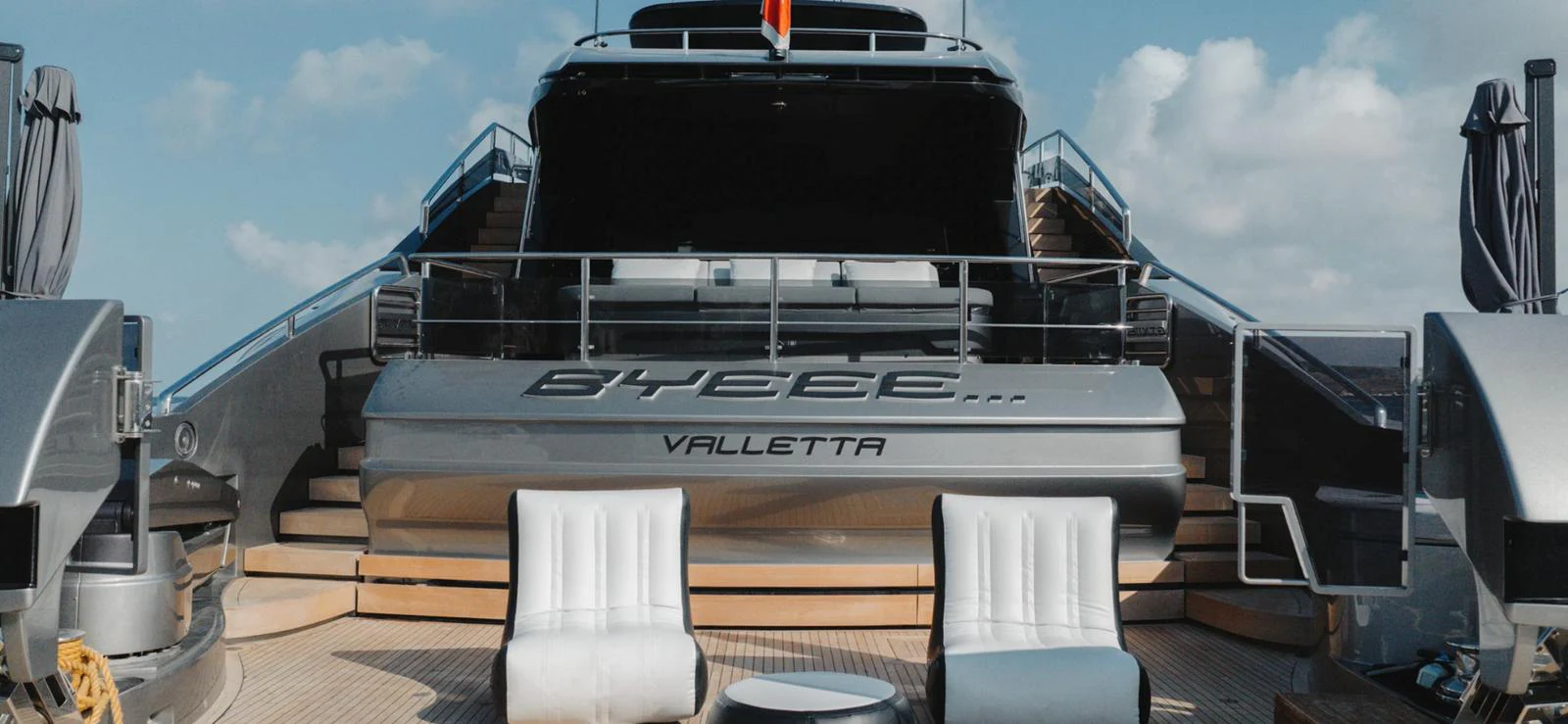 The aft deck of this yacht features comfortable seating and a sleek design, perfect for relaxation. aboard BYEEE... Yacht for Sale