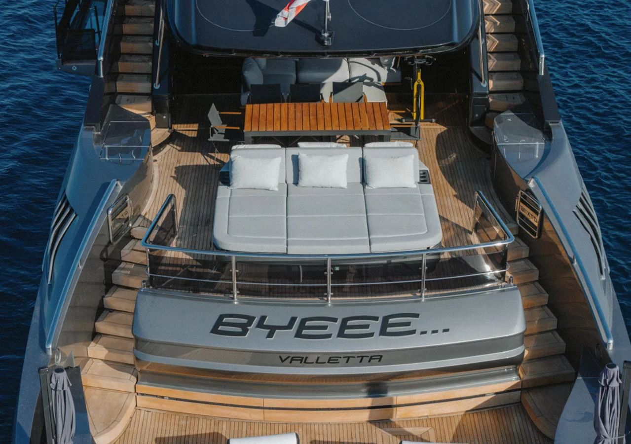 The aft deck of this yacht features a luxurious lounging area with plush seating and a stylish design. aboard BYEEE... Yacht for Sale