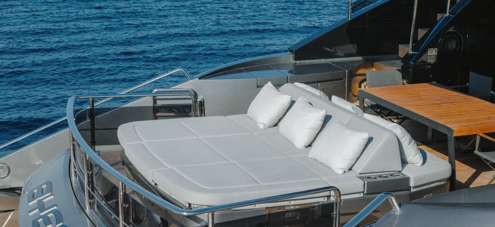 The sundeck features a luxurious sunbed with plush cushions, perfect for relaxation. aboard BYEEE... Yacht for Sale