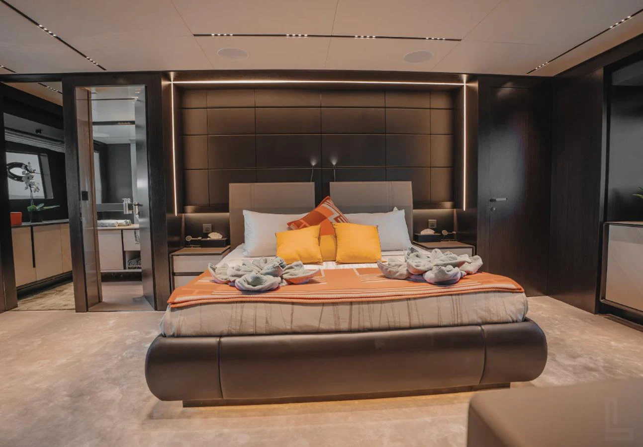 The master stateroom features a luxurious bed with elegant decor and modern furnishings. aboard BYEEE... Yacht for Sale