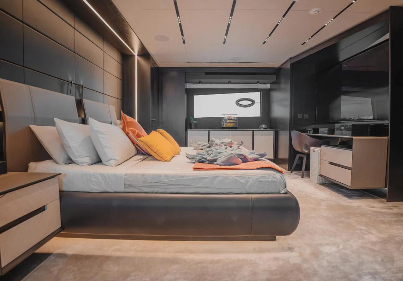 The master stateroom features a luxurious bed with modern furnishings and ample natural light. aboard BYEEE... Yacht for Sale