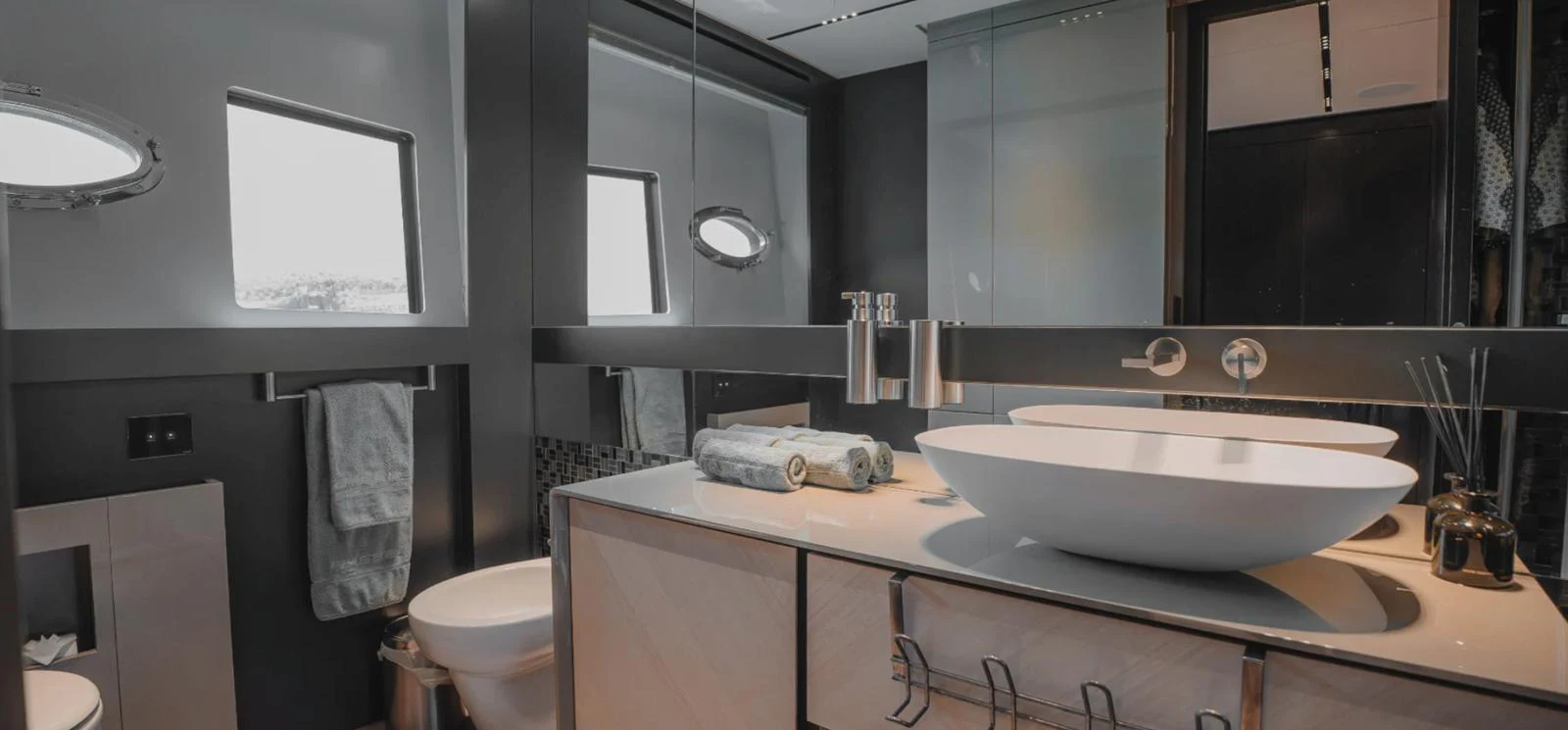 The yacht's bathroom features modern fixtures and a sleek design. aboard BYEEE... Yacht for Sale