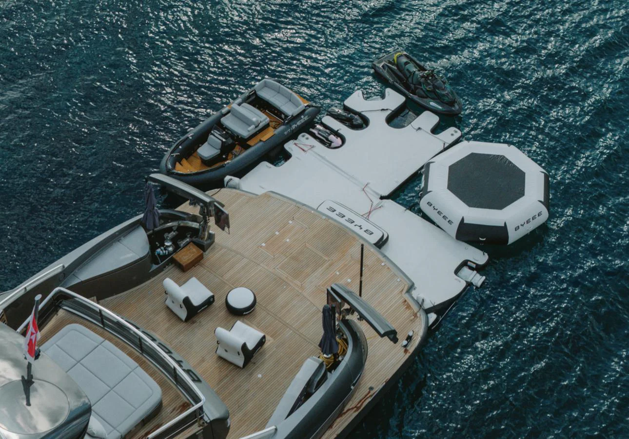 The aft deck features a spacious lounging area with direct access to water toys and inflatables. aboard BYEEE... Yacht for Sale