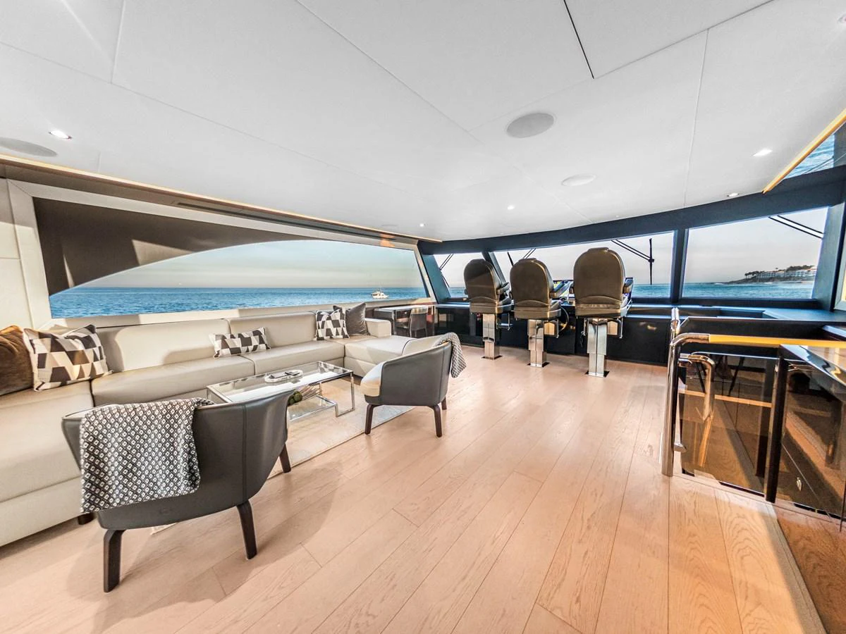 The salon offers a spacious and modern living area with panoramic ocean views. aboard LONE STAR Yacht for Sale