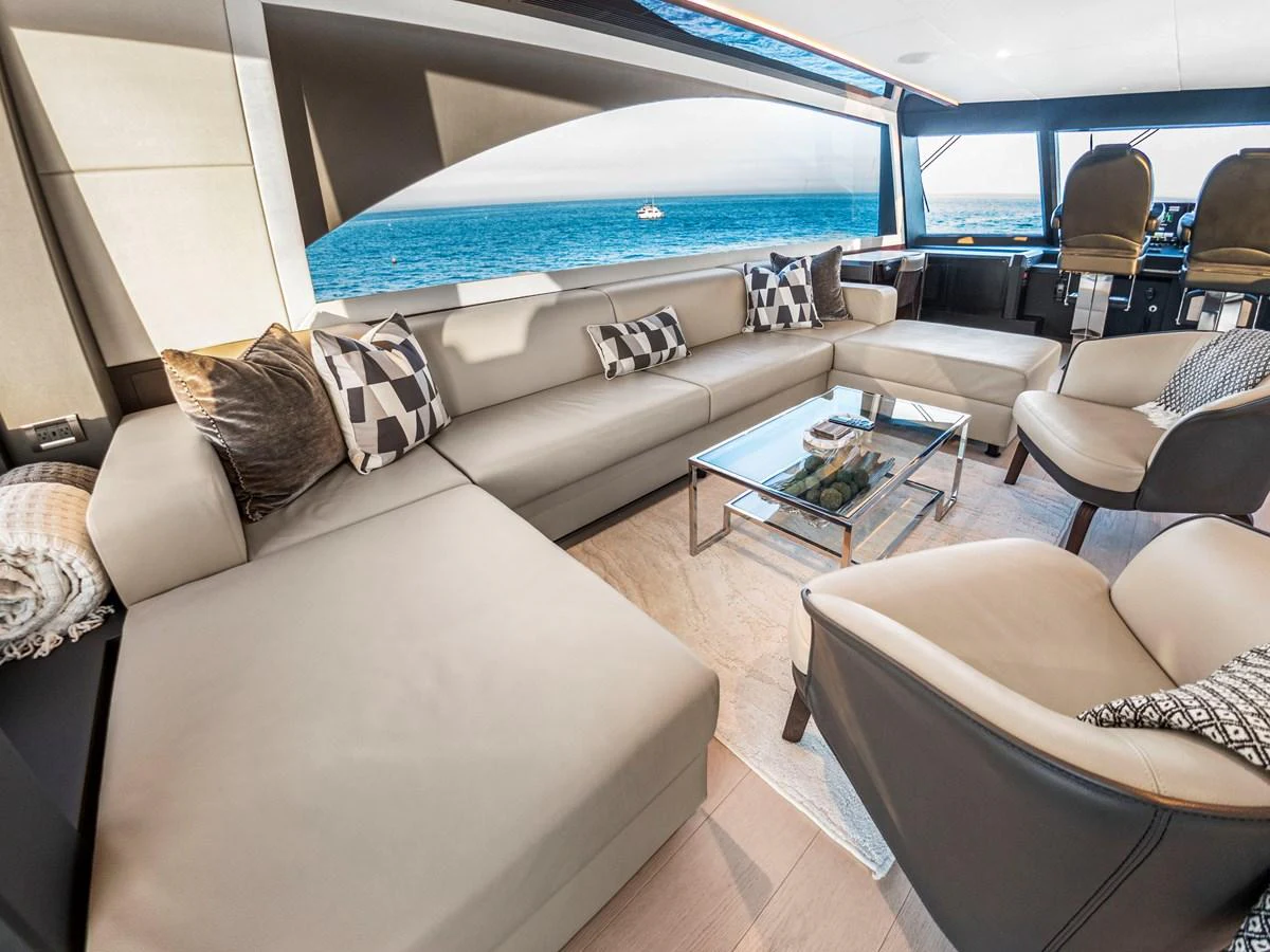 The salon offers a spacious and luxurious seating area with a stunning view of the sea. aboard LONE STAR Yacht for Sale