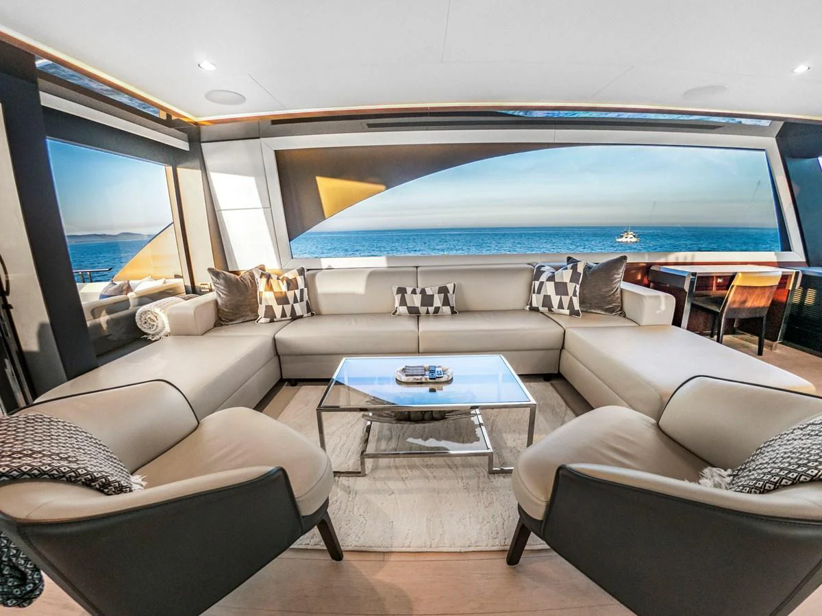 The salon offers a spacious and elegant seating area with panoramic ocean views. aboard LONE STAR Yacht for Sale