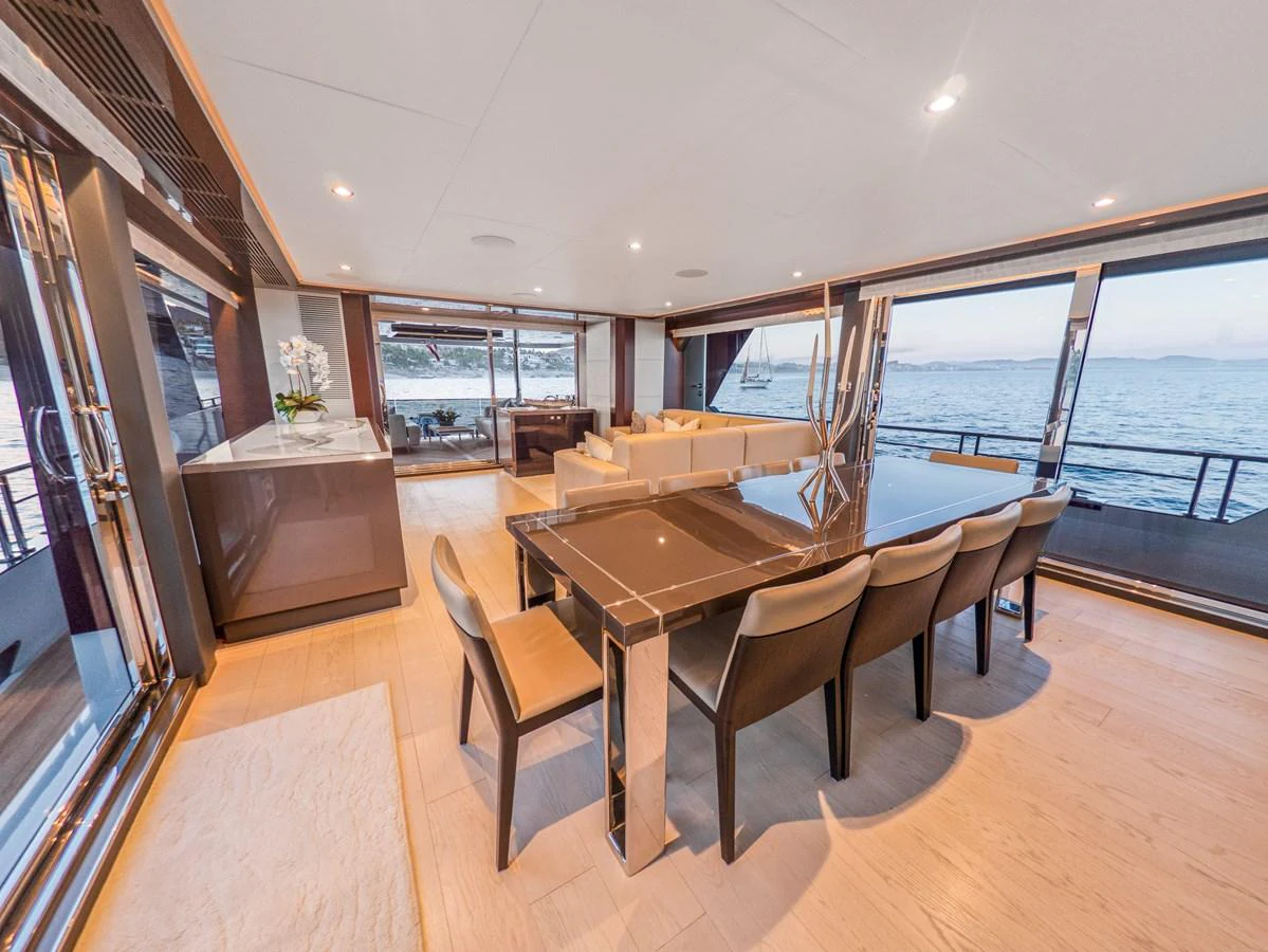 The spacious salon offers panoramic views and luxurious seating arrangements. aboard LONE STAR Yacht for Sale