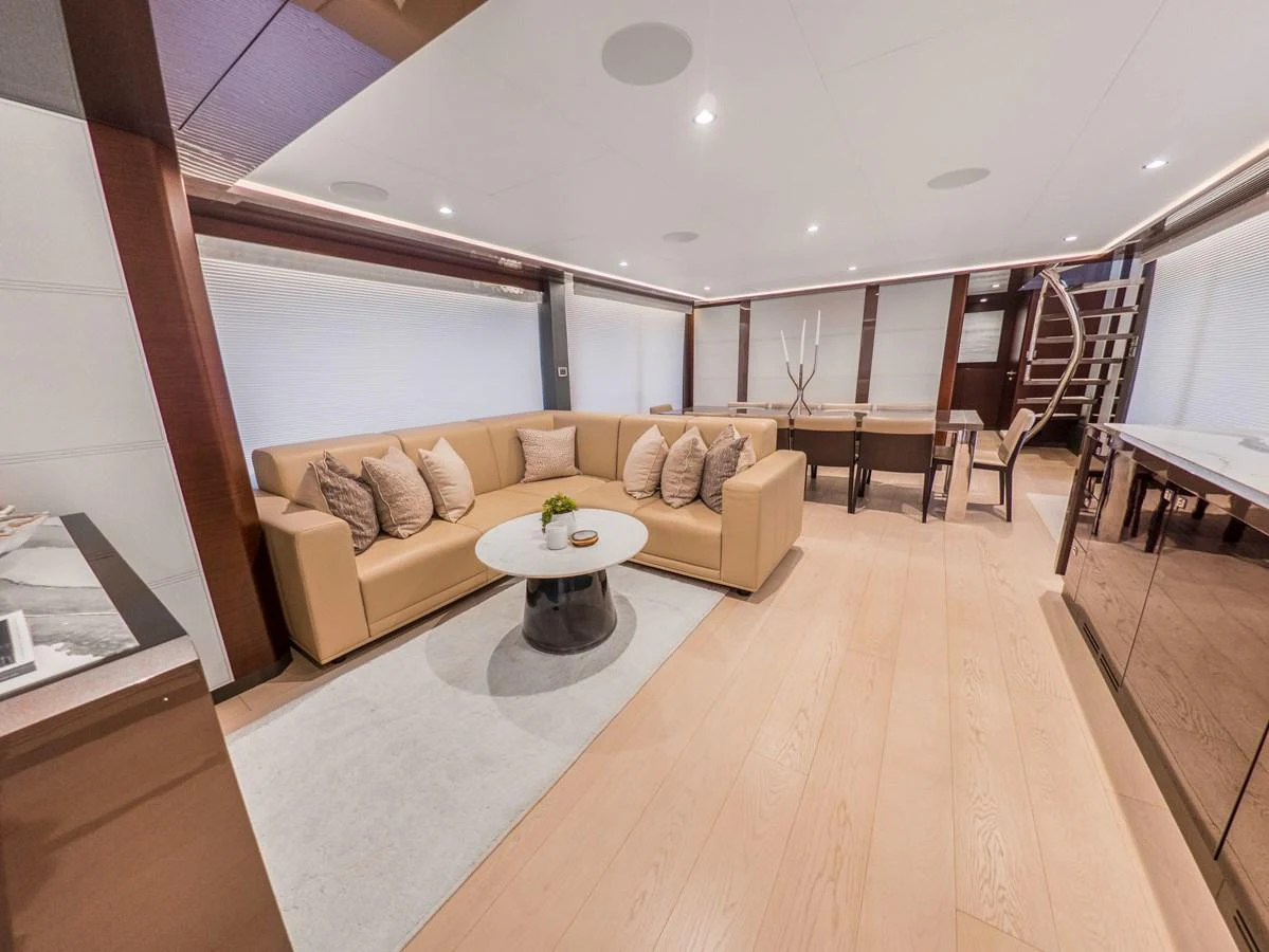 The salon features a luxurious seating area with a modern, elegant design. aboard LONE STAR Yacht for Sale