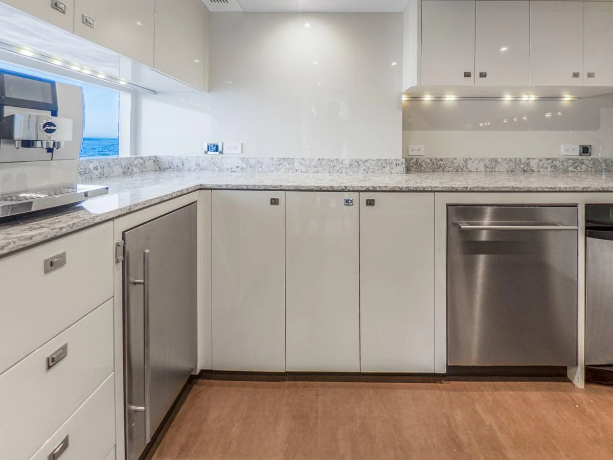 The yacht's galley features modern appliances and sleek cabinetry, perfect for gourmet meal preparation. aboard LONE STAR Yacht for Sale