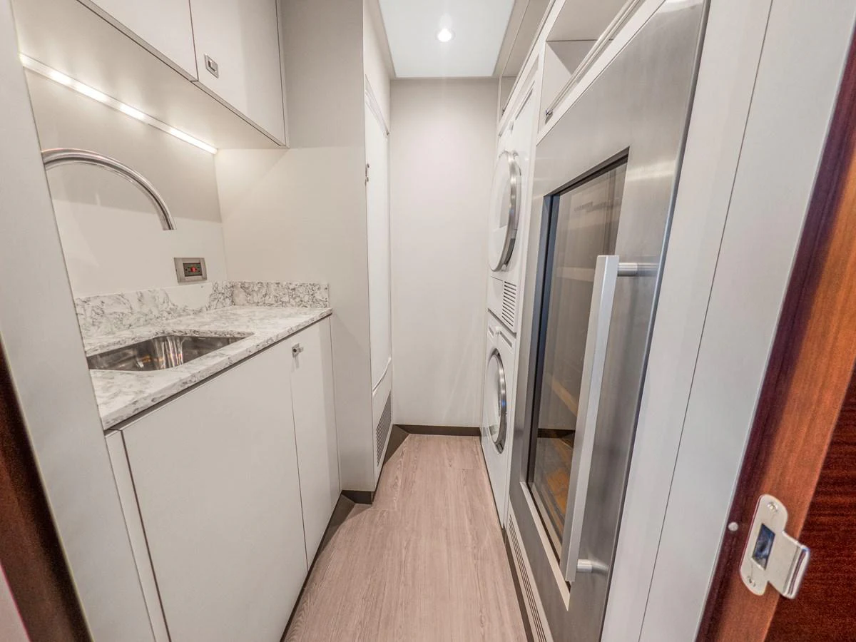 The compact galley features modern appliances and sleek cabinetry, ideal for efficient meal preparation. aboard LONE STAR Yacht for Sale