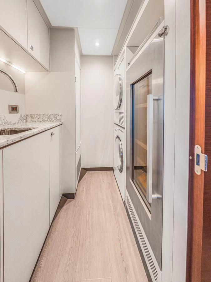 The yacht's galley features modern appliances and a sleek design for convenient onboard cooking. aboard LONE STAR Yacht for Sale