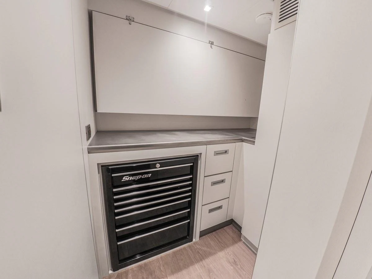 A sleek and functional galley area with ample storage and a professional-grade tool chest. aboard LONE STAR Yacht for Sale