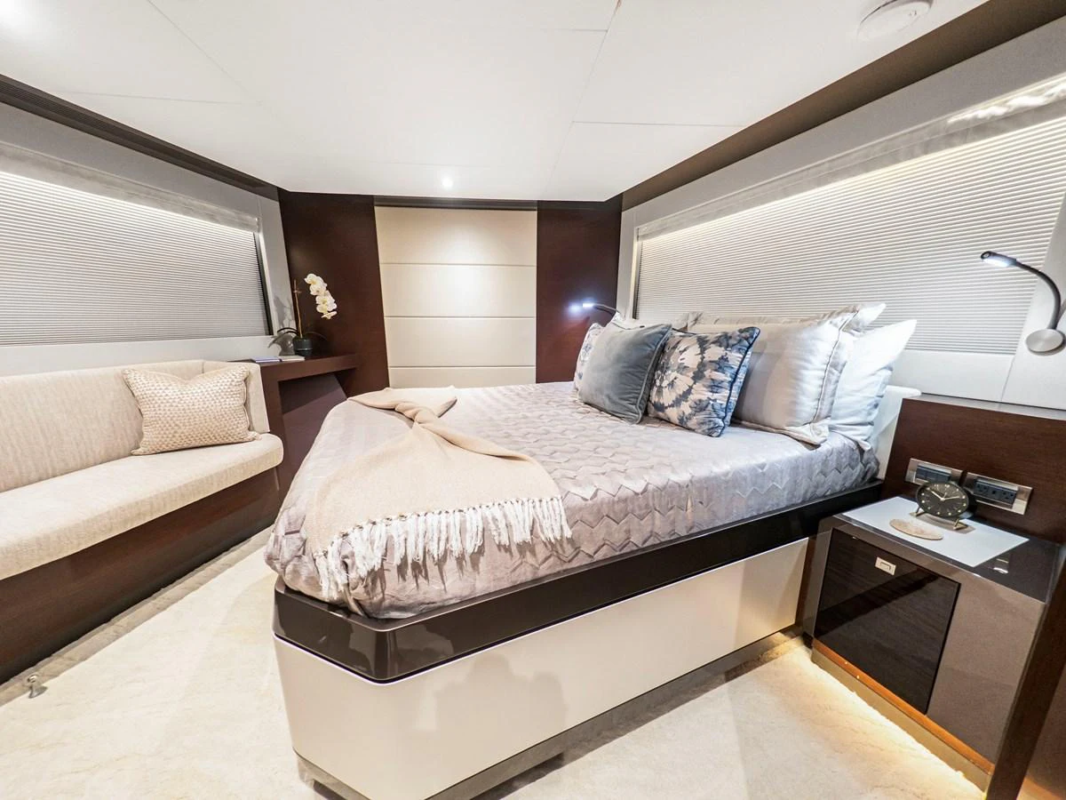 The stateroom offers a luxurious and comfortable sleeping area with elegant decor. aboard LONE STAR Yacht for Sale