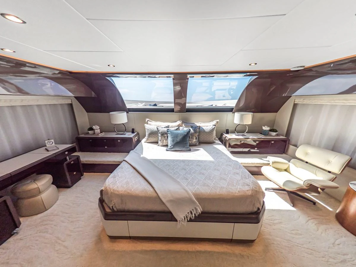 The master stateroom offers a luxurious and spacious retreat with elegant furnishings and ample natural light. aboard LONE STAR Yacht for Sale