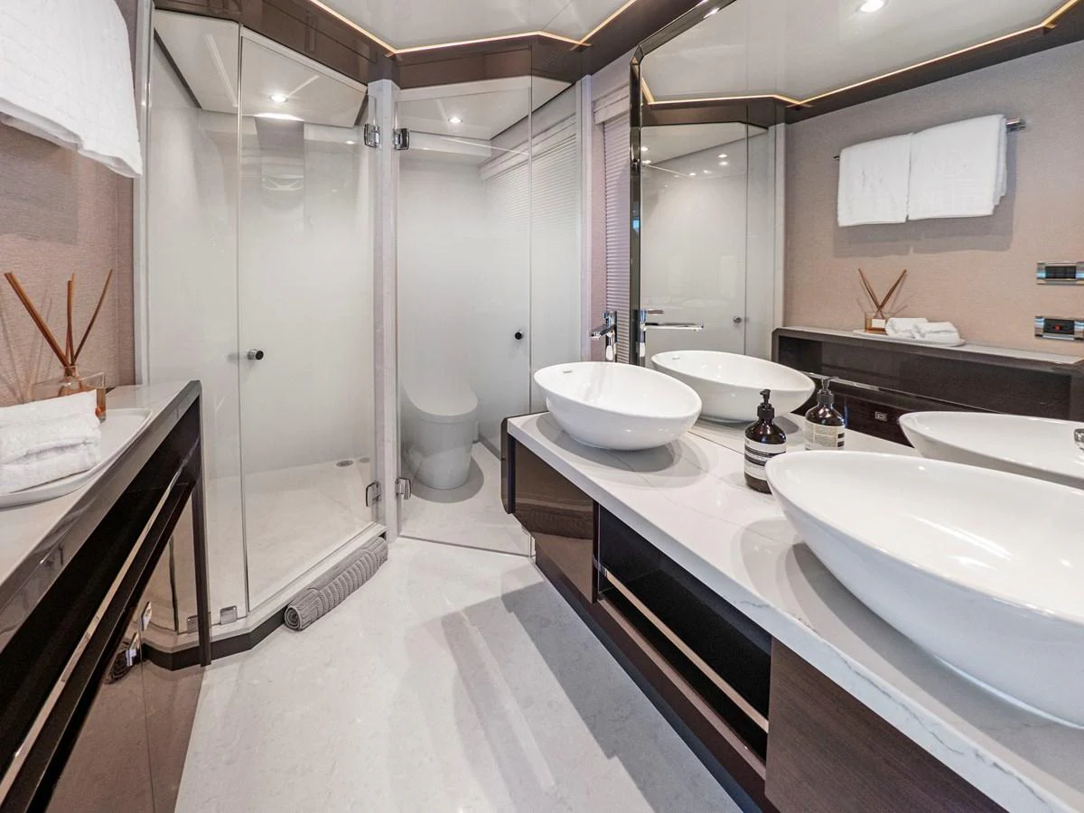 The yacht's bathroom features modern fixtures and a spacious shower area. aboard LONE STAR Yacht for Sale