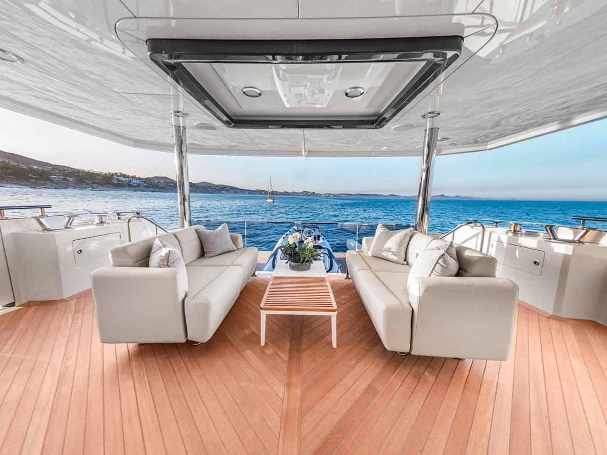 The aft deck offers a spacious and inviting area with comfortable seating and stunning ocean views. aboard LONE STAR Yacht for Sale