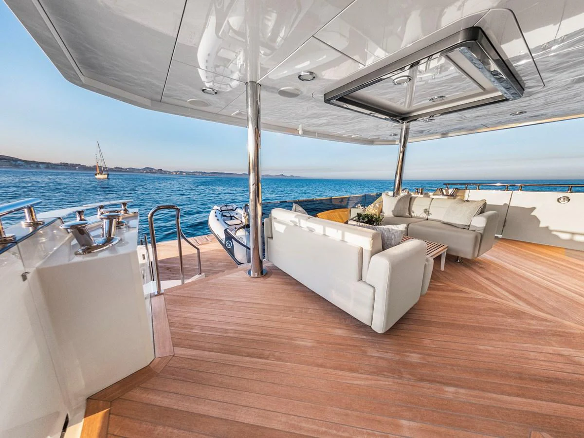 The aft deck offers a luxurious outdoor seating area with stunning ocean views. aboard LONE STAR Yacht for Sale