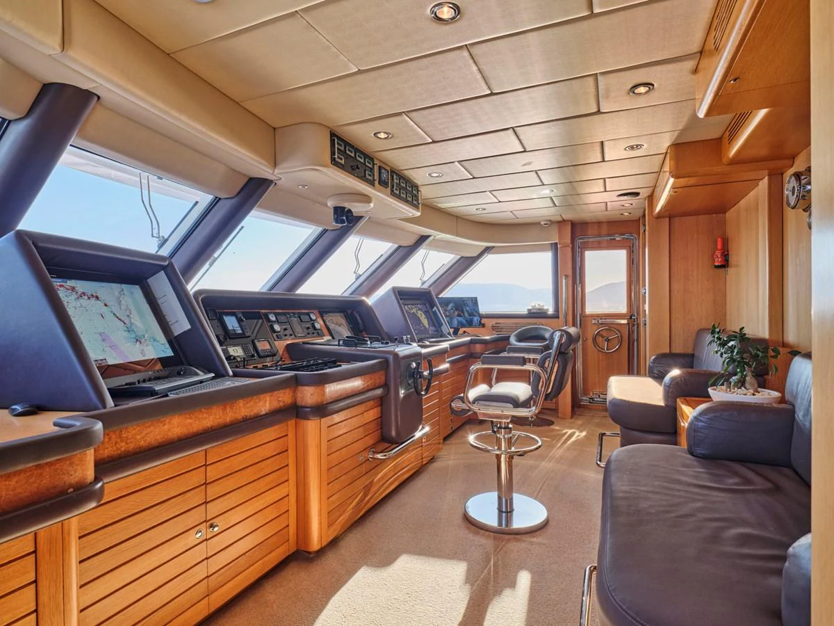 The helm station features state-of-the-art navigation equipment and luxurious seating. aboard SAHAB IV Yacht for Sale