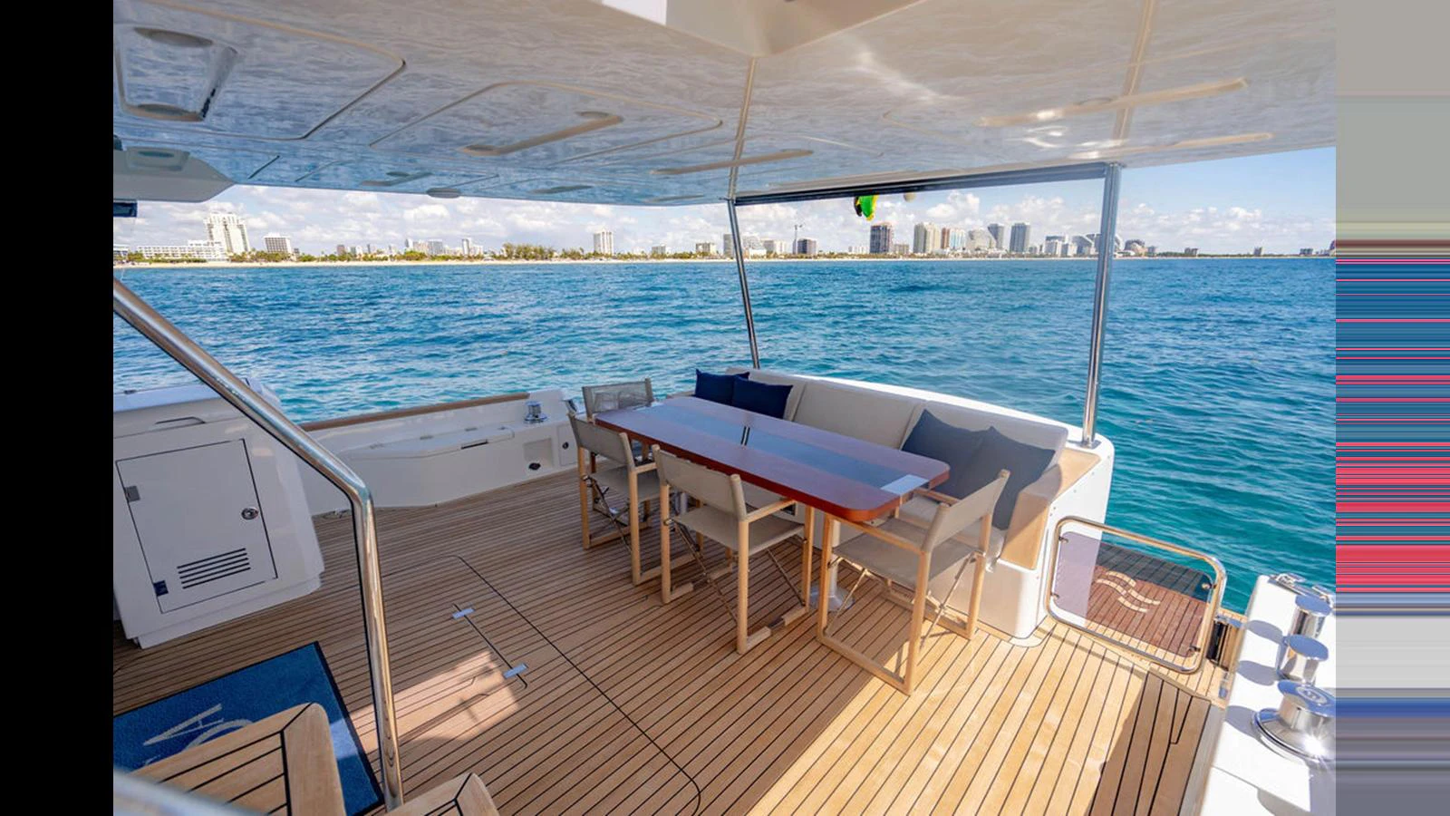 The aft deck offers a spacious and inviting area for alfresco dining with stunning ocean views. aboard NIVASA Yacht for Sale