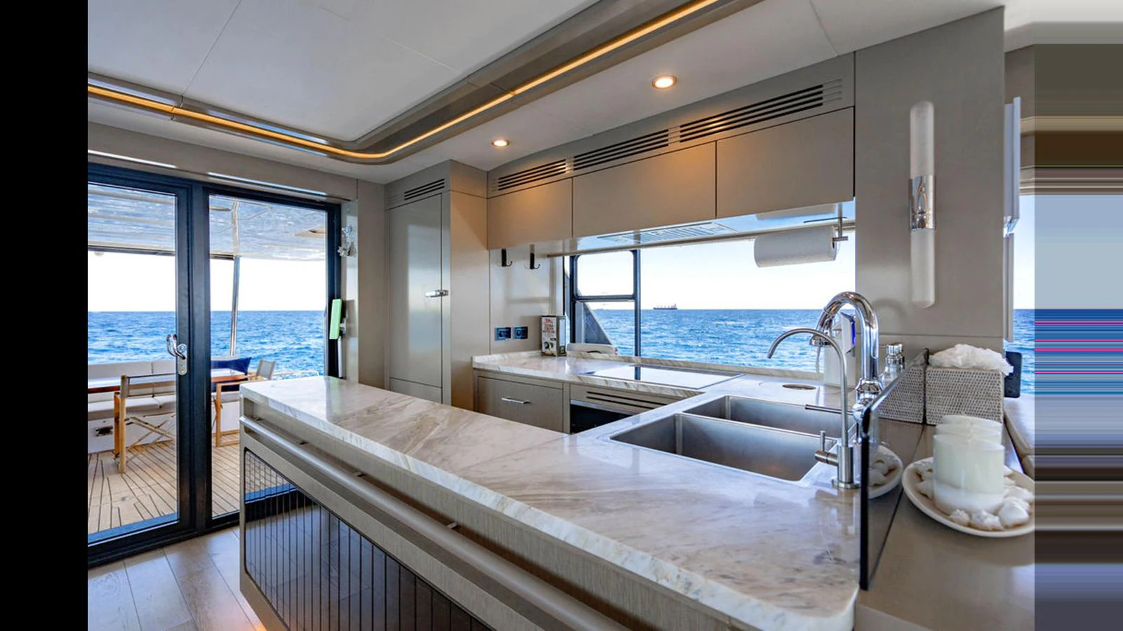 The modern galley offers stunning ocean views and sleek, high-end finishes. aboard NIVASA Yacht for Sale
